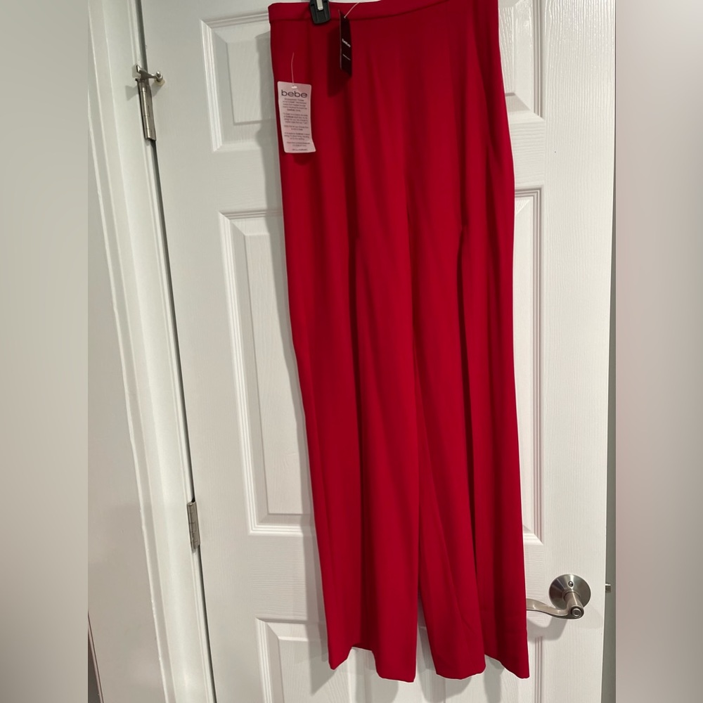 NWT Bebe palazzo pants with opening in the front.